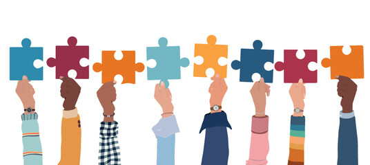 Problem solving concept. Raised hand up of multicultural business women and business men holding a jigsaw puzzle piece. Metaphor.Strategy concept.Joining puzzle pieces.Match.Isolated