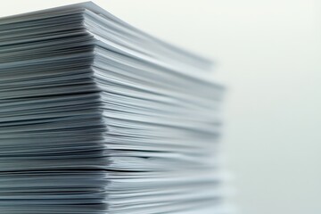 A large stack of plain white paper is shown closely