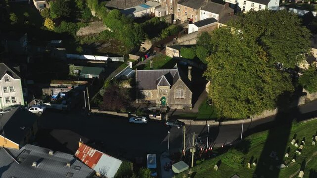Clones Town, County Monaghan, Ireland, September 2022. Drone orbits counter clockwise around Cassandra Hand Heritage Centre, highlighting its historic architecture and lush surroundings.