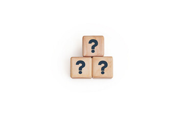 Three wooden blocks with dark question marks stacked in a pyramid shape against white background. Symbolizing for concepts like problem-solving, brainstorming, or business strategy presentations.