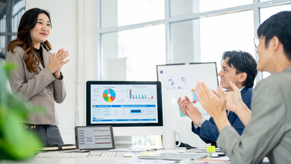 Businesswoman or female office worker is getting applause from coworkers. Clapping hands for speaker