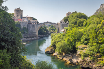 The Stari Most bridge, old bridge on Neretva river in Mostar town, Bosnia and Herzegovina, Europe. Picturesque stone bridge elegantly arches over the tranquil river.