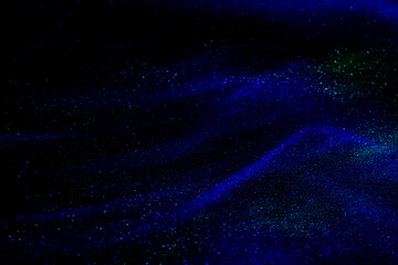 abstract blue and green speed camera motion background over glowing lights with sparkles, stars.