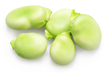 Several green young broad beans isolated on white background.