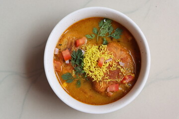 kat vada or kat wada or vada usal, an authentic dish made with deep-fried potato dumplings and spicy gravy, street food, Indian food