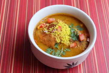 kat vada or kat wada or vada usal, an authentic dish made with deep-fried potato dumplings and spicy gravy, street food, Indian food