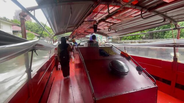 BANGKOK, THAILAND - AUGUST 2024 : View of riding on canal boat at khlong saen saep (canal river).