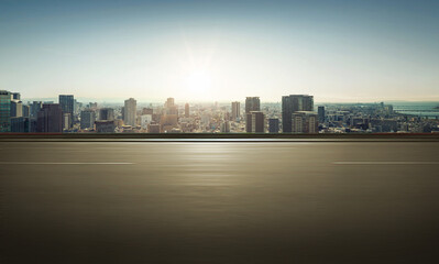 Panoramic side view of motion blur asphalt road and cityscape background.