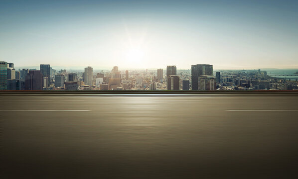 Panoramic side view of motion blur asphalt road and cityscape background.