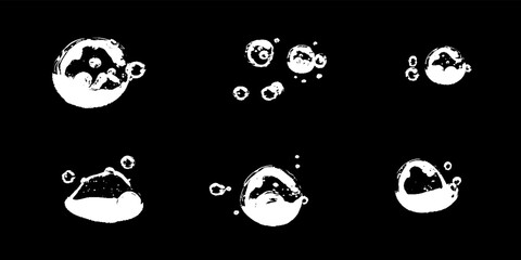 Water bubbles dance gracefully in a dark backdrop, creating an enchanting visual symphony of shapes and reflections