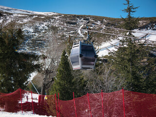 Gondola lifts that go to the top of the ski resort so that skiers and snowboarders can start the...