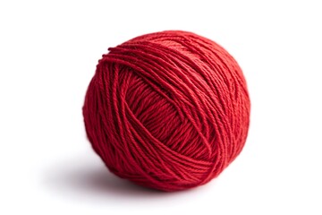 A perfectly wound ball of vibrant crimson yarn ready for a cozy winter knitting project against a stark white background.