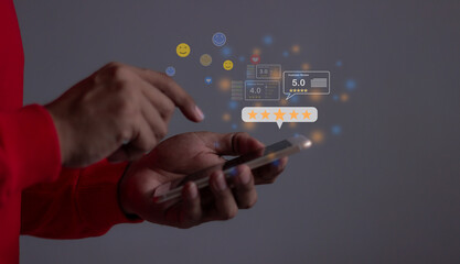 Consumer Satisfaction, Young Man hand holding Smart Phone with five star to review and give 5 stars with very good results in service, Good review 5 star rating choice feedback