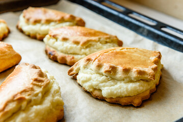 Homemade sochniki (sochni) with cottage cheese. Traditional Russian shortbread with cottage cheese.