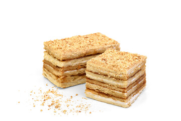 Slice of honey cake isolated on white background.