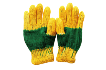 Colorful knitted gloves on a light background showcasing vibrant green and yellow patterns for winter warmth and comfort