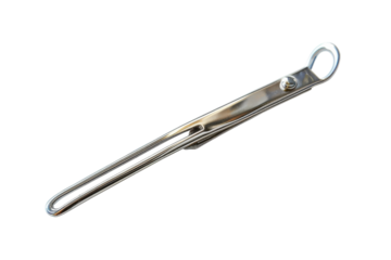 A sleek and shiny metal tie clip resting on a white surface, showcasing elegance and style