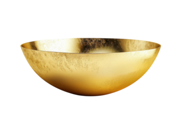 Radiant golden bowl reflecting soft light in an elegantly simple setting