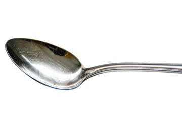 A gleaming stainless steel spoon resting gracefully on a white surface with intricate reflections