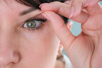 The woman has a drooping eyelid