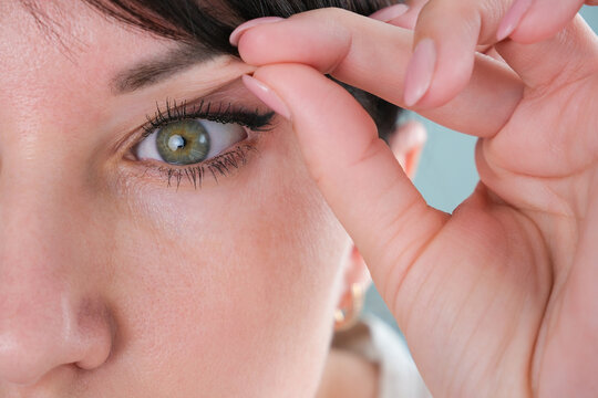 The woman has a drooping eyelid