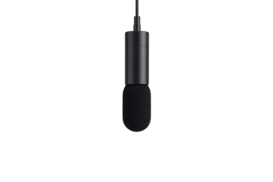 A modern black microphone with a foam windscreen hovers in darkness, evoking clarity, precision, and the essence of spoken or recorded sound, isolated on a transparent background