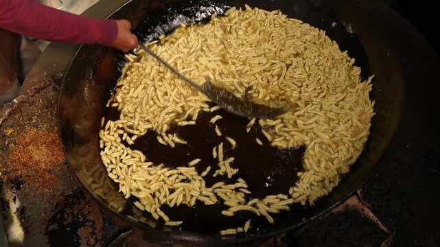 Making of Bengali spicy food chanachur.
