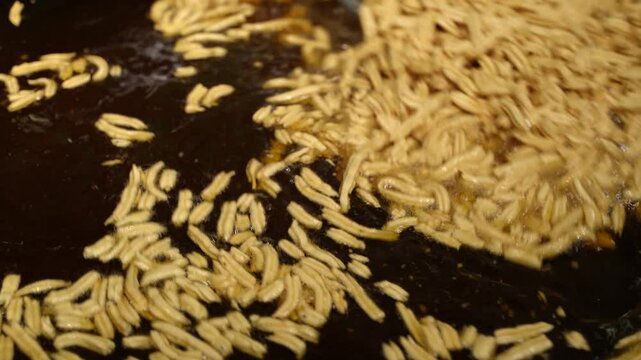 Making of Bengali spicy food chanachur.