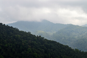 Obraz premium Dust pm 2.5 and Mist Clouds, High Angle Landscape view over Forest Mountains at Doi Langka Noi, Khun Chae National Park Northern Thailand.