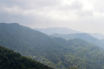 Fototapeta premium Dust pm 2.5 and Mist Clouds, High Angle Landscape view over Forest Mountains at Doi Langka Noi, Khun Chae National Park Northern Thailand.