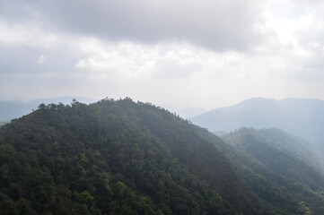 Dust pm 2.5 and Mist Clouds, High Angle Landscape view over Forest Mountains at Doi Langka Noi, Khun Chae National Park Northern Thailand.