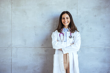Smiling Female Doctor Standing Confidently Against a Modern Office Background