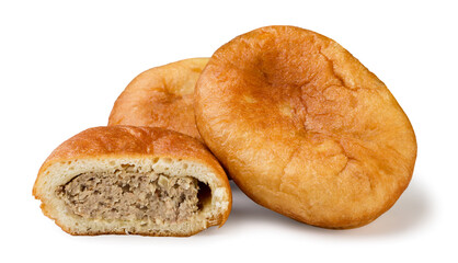 Meat pies and half on a white background. Isolated