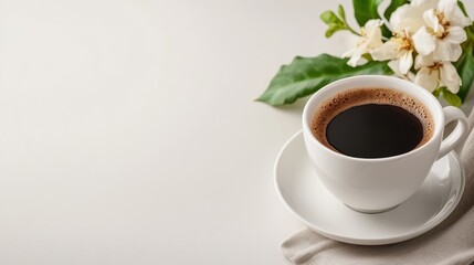 A beautifully crafted white cup filled with steaming black coffee sits elegantly next to delicate flowers, highlighting a serene morning moment perfect for relaxation.