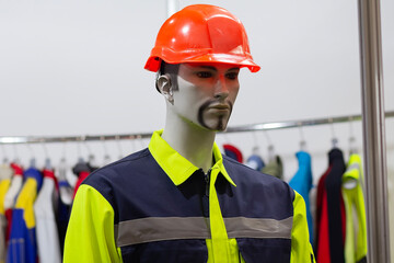 Mannequin in a protective helmet and working overalls