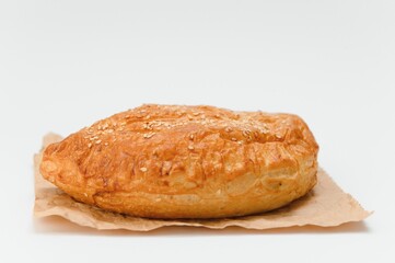 Brazilian pastry packed in brown paper on a white background