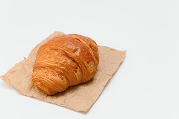 fresh baked croissant isolated on white background