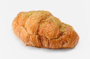 fresh baked croissant isolated on white background