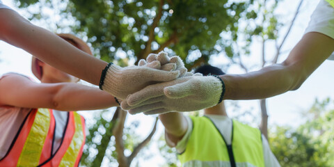 Unity for sustainability. Team members unite in a show of solidarity during an environmental...