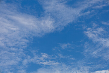 Blue Sky with Wispy and Textured White Clouds