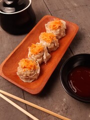 Chicken And Shrimp Dim Sum With Carrot Topping