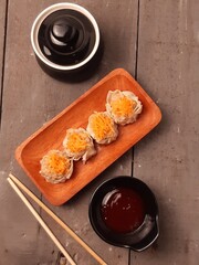 Chicken And Shrimp Dim Sum With Carrot Topping