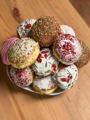 Multicolored Donuts on Plate Close-up