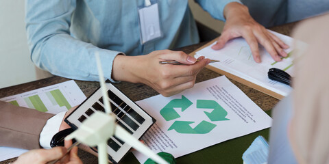 Sustainable Practices and Corporate Responsibility. A team evaluating their environmental impact...