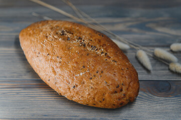 Fresh bread isolated on a wooden background