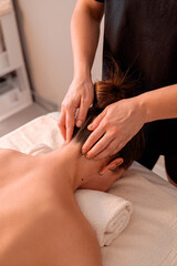 A professional back and neck massage for women in a salon, providing relaxation, stress relief, and muscle tension reduction. A perfect self-care and wellness treatment