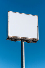Obraz premium Blank Billboard Against Blue Sky