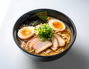 Close-up of a bowl of ramen with chopsticks lifting steaming noodles, showcasing rich broth, fresh toppings, white background