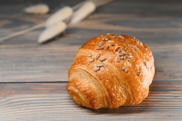 fresh croissant on a wooden background