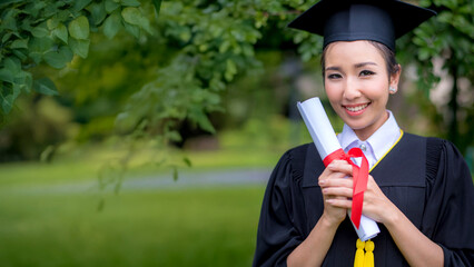 Graduate woman students wearing graduation hat and gown, congratulations for end of study	